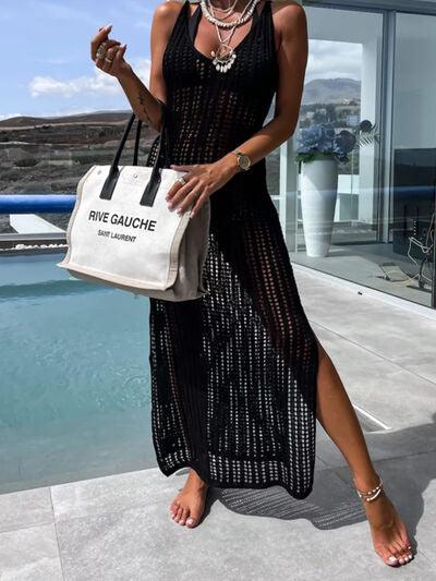 a woman in a black dress holding a white bag