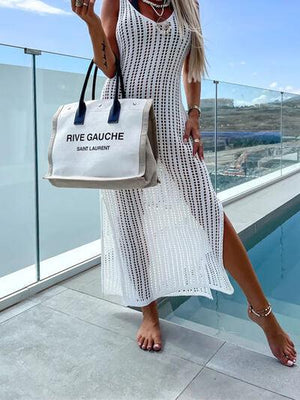 a woman in a white dress holding a white bag