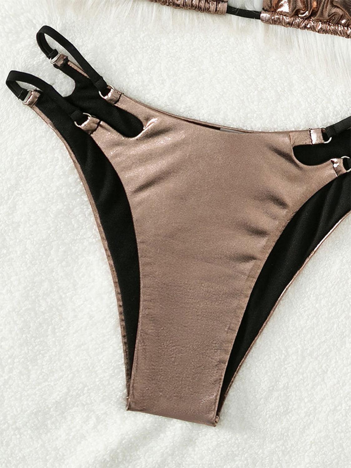a bikini top with black straps and a pink bikini bottom