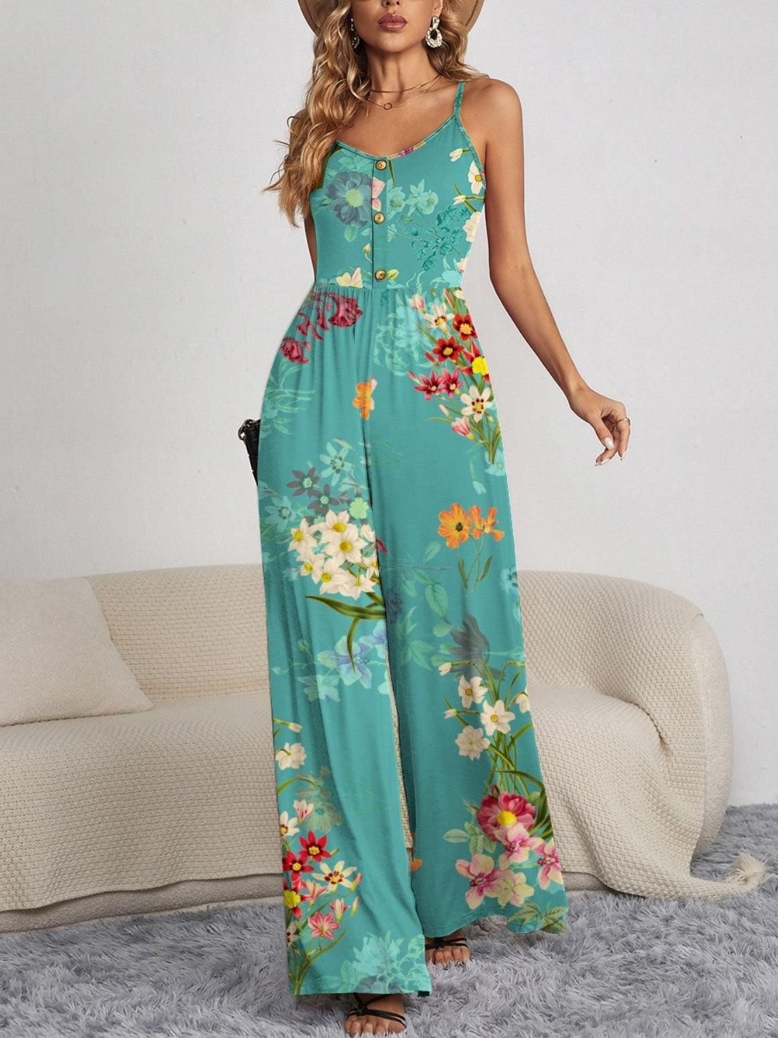 a woman in a blue floral print jumpsuit