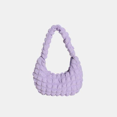 a small purple bag on a white background