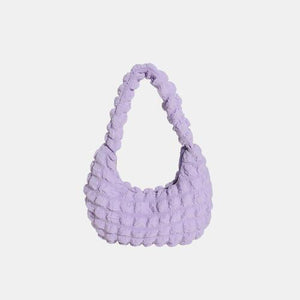 a small purple bag on a white background