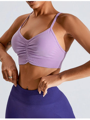 a woman in a purple sports bra top