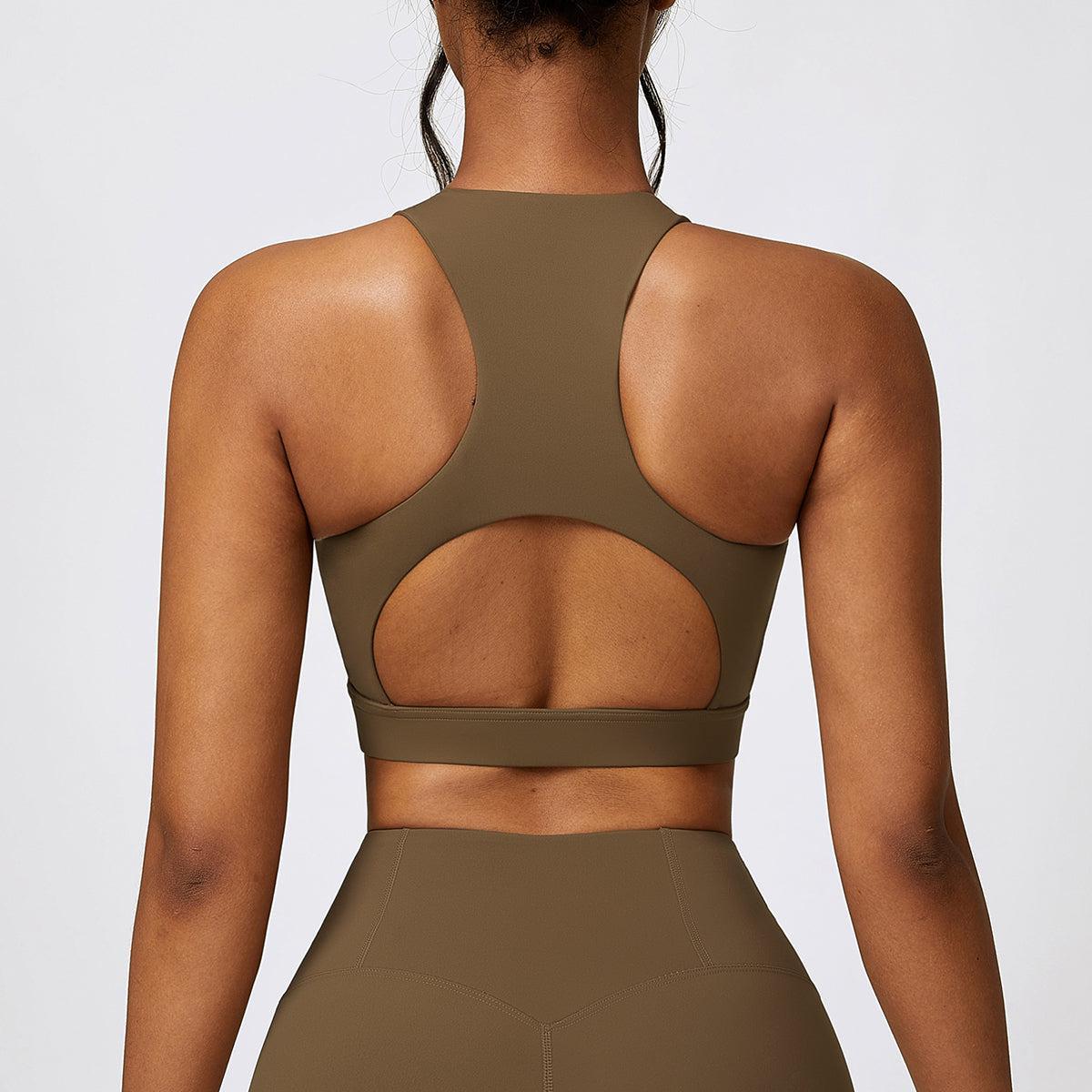 the back of a woman wearing a brown sports bra