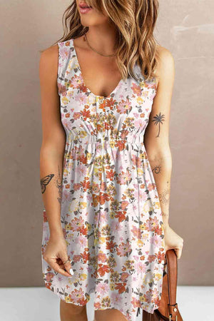 a woman wearing a dress with flowers on it