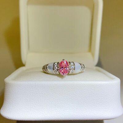 a close up of a ring in a box