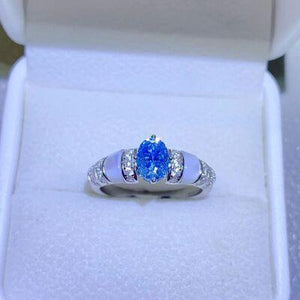 a blue and white ring in a white box