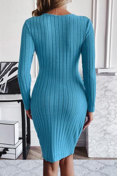 a woman in a blue sweater dress