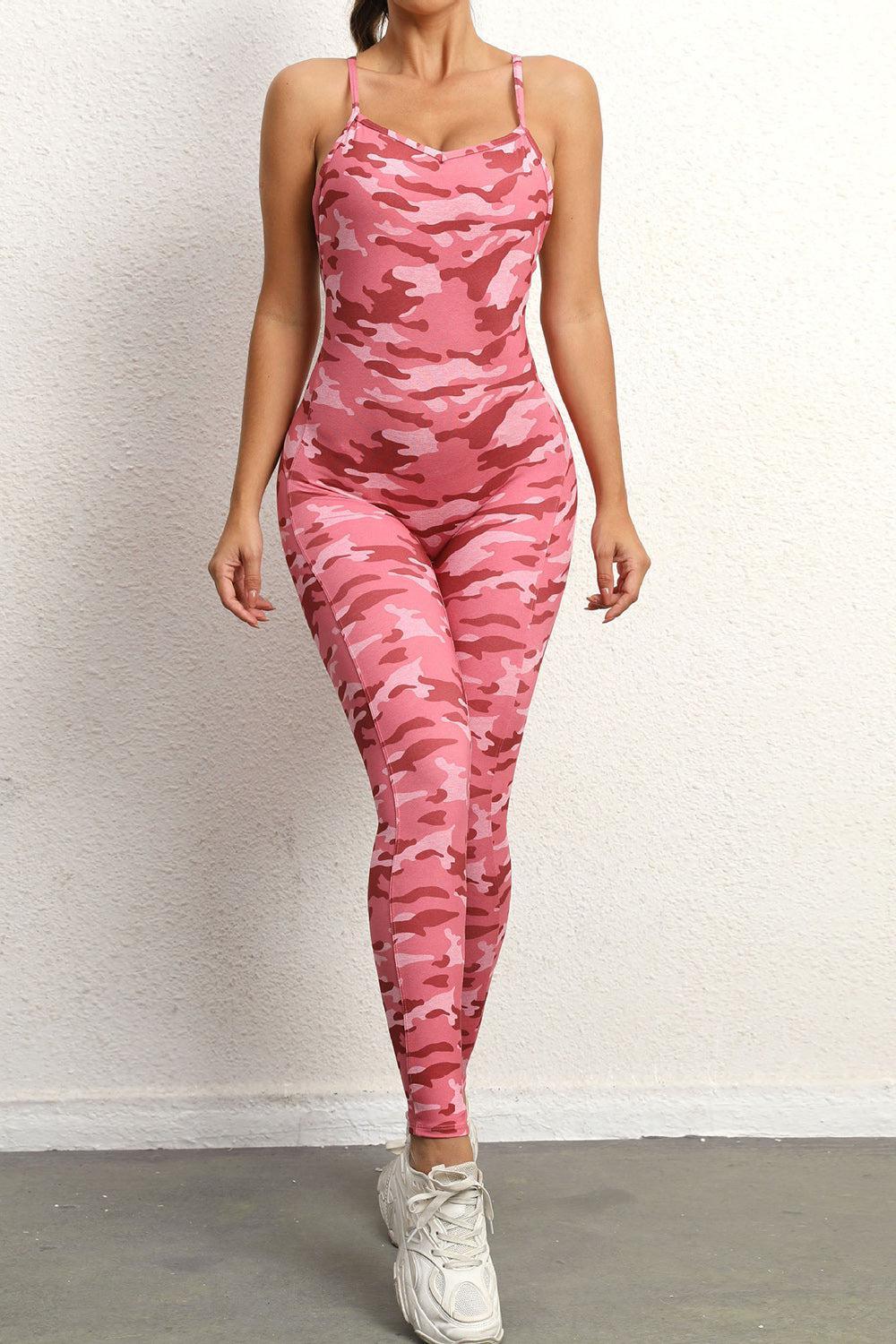 a woman in a pink camo print jumpsuit