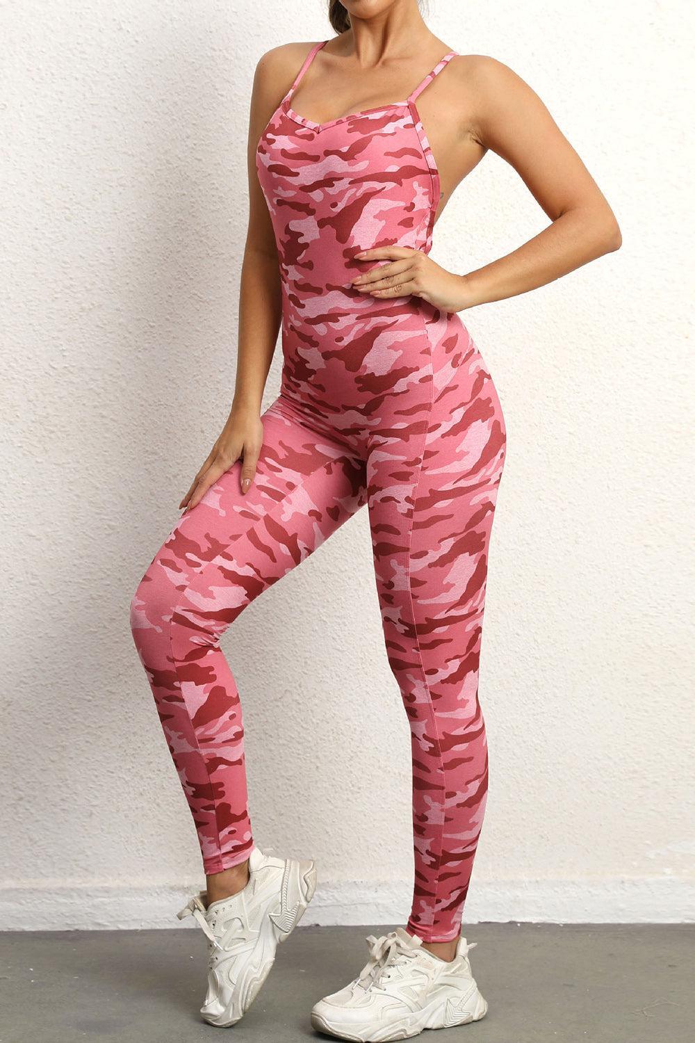 a woman in a pink camo sports bra top and leggings