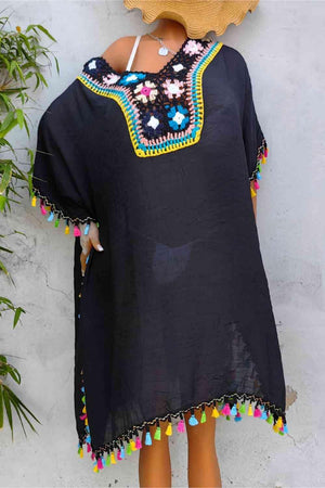 a woman wearing a black dress and a straw hat