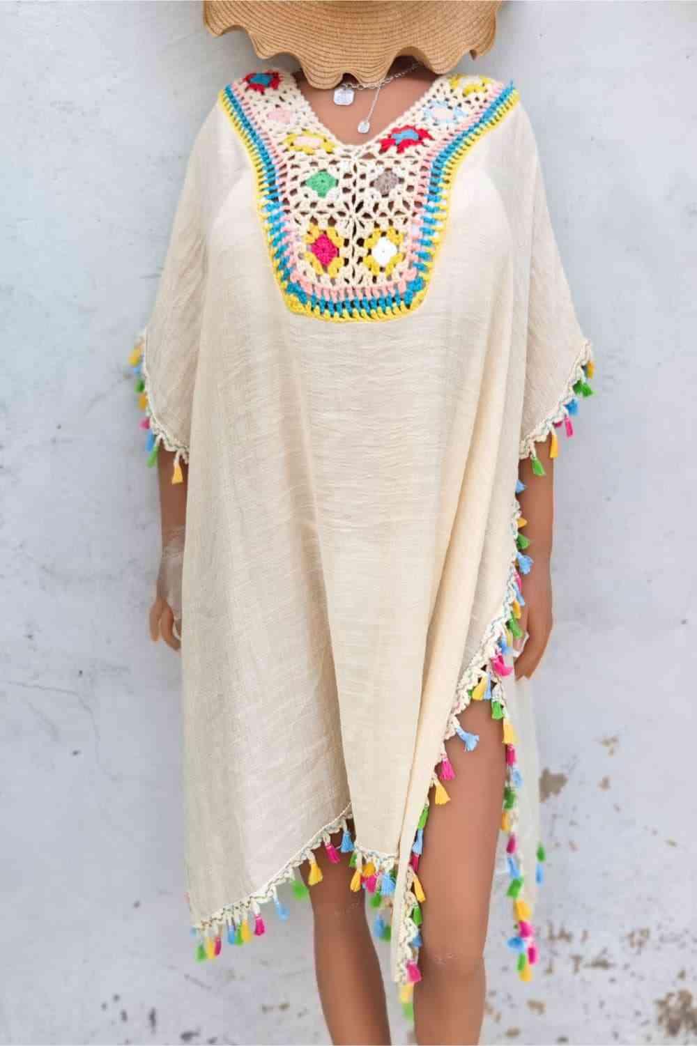 a woman wearing a hat and a poncho