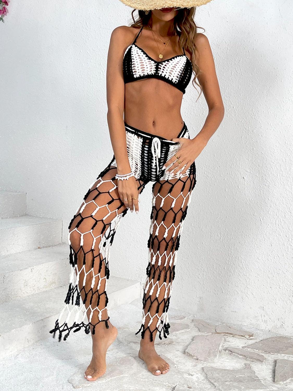 a woman in a bikini top and netted pants