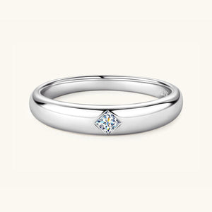 a white gold ring with a princess cut diamond