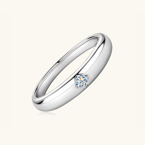 a white gold ring with a princess cut diamond