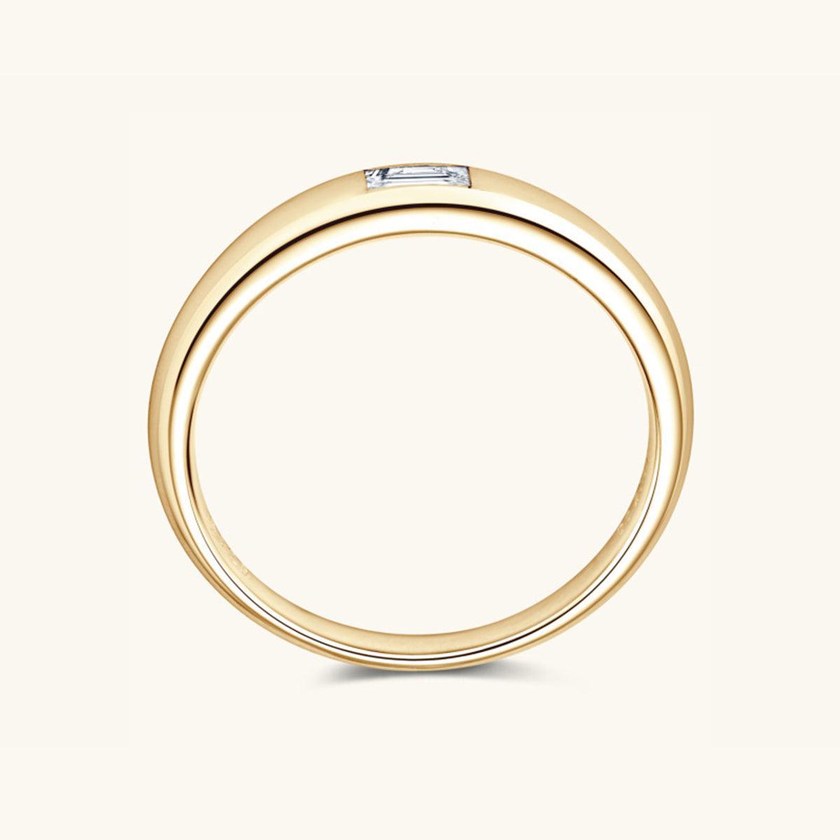 a yellow gold wedding ring with a diamond set in the center