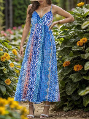 a woman wearing a blue dress and a straw hat