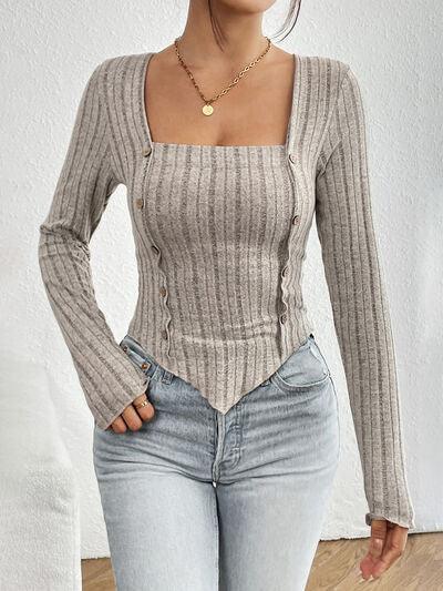 a woman standing in a room with her hands on her hips