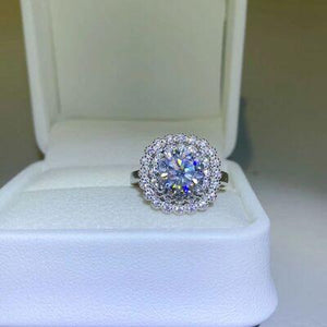 a diamond ring in a box on a table