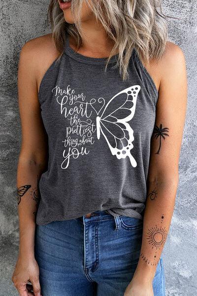 a woman wearing a grey tank top with a butterfly on it
