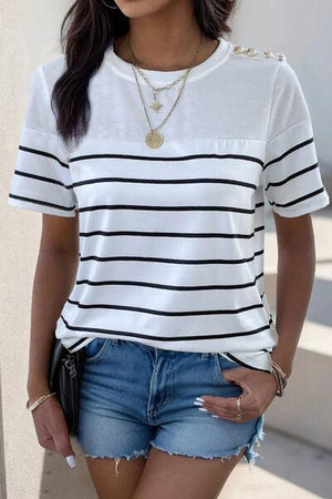 a woman wearing a white and black striped shirt