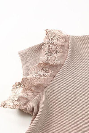 a sweater with a ruffled edge on a white background