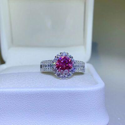 a pink and white diamond ring in a box