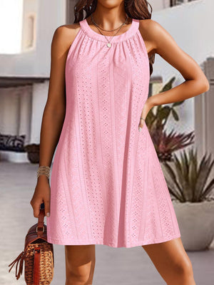 a woman in a pink dress posing for a picture