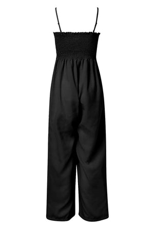 a black jumpsuit with straps on the side