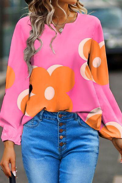 a woman in a pink top and blue jeans