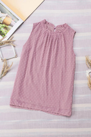 a pink dress with white polka dots on it