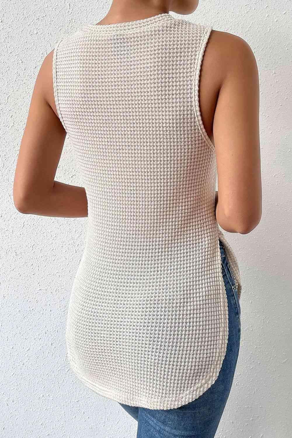 a woman wearing a white knit tank top