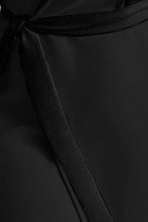 a close up of a black dress with a tie