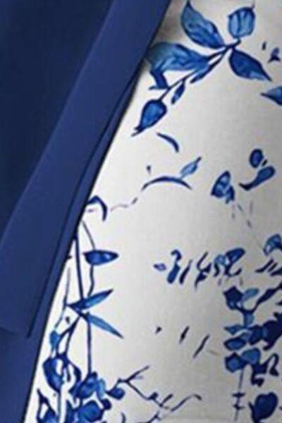 a close up of a blue and white dress on a mannequin