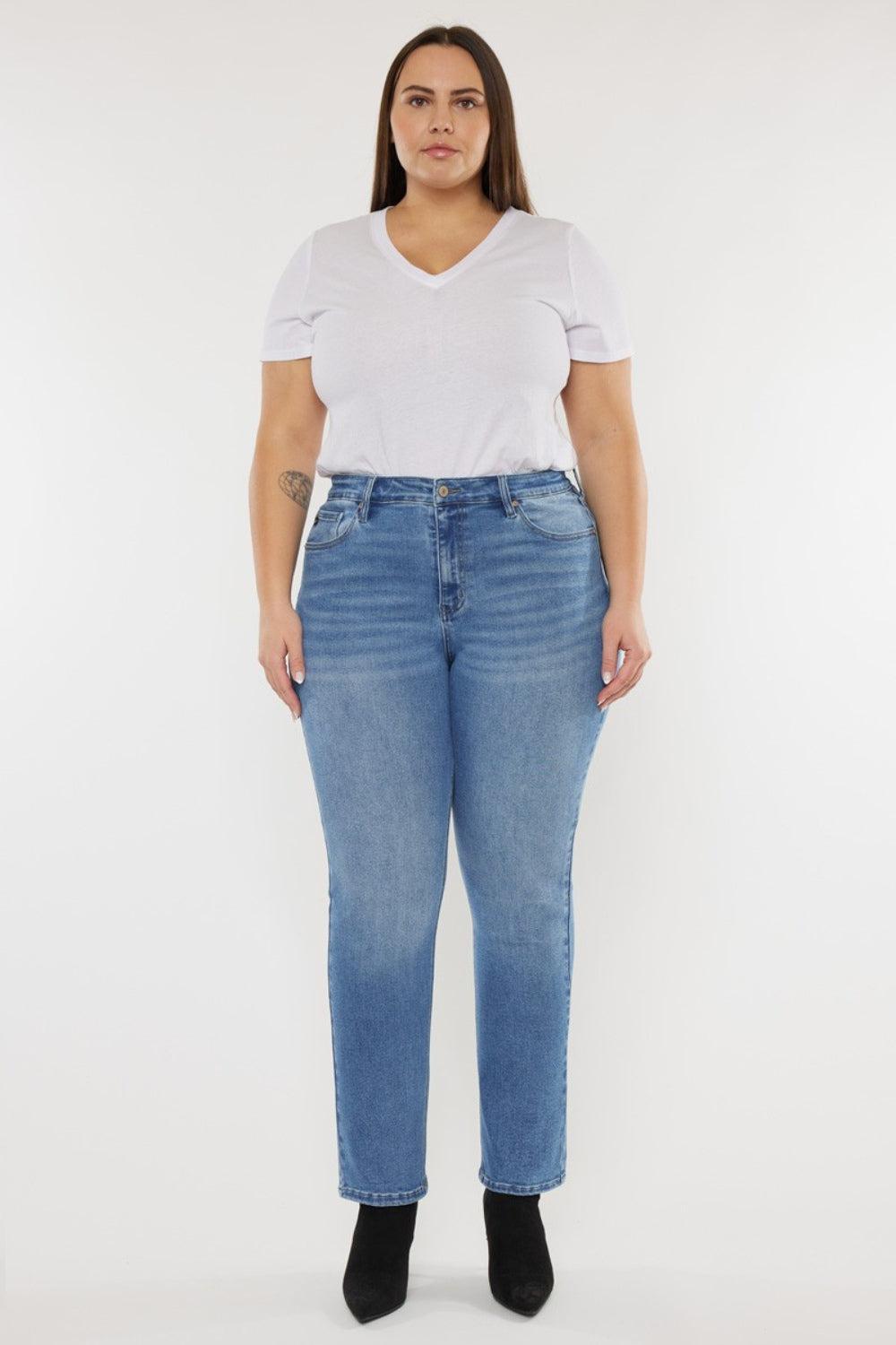 a woman wearing a white t - shirt and blue jeans