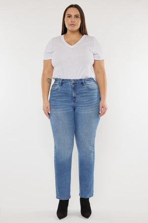 a woman wearing a white t - shirt and blue jeans