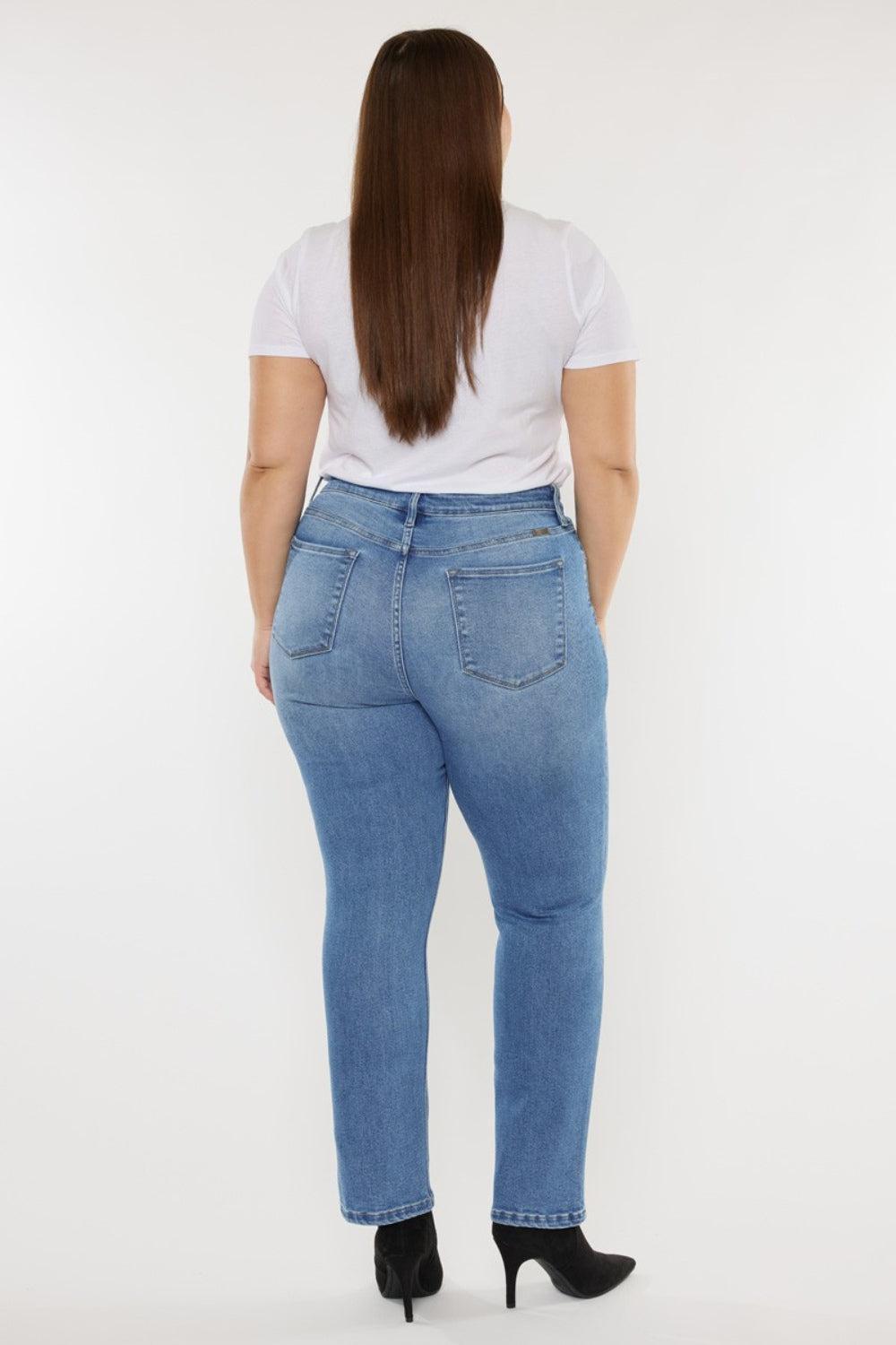 a woman in a white shirt and jeans
