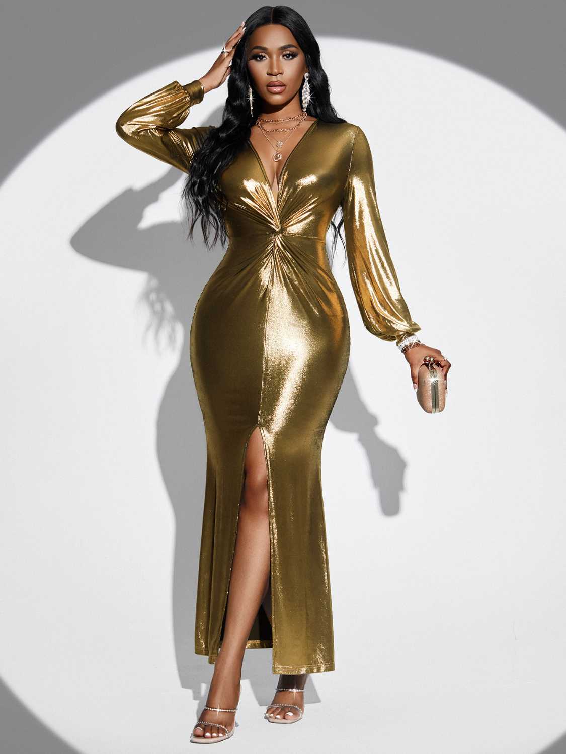 a woman in a gold dress posing for a picture