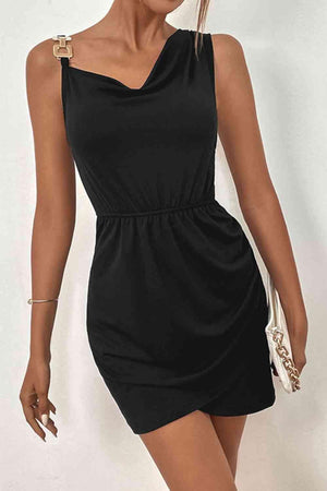 a woman in a black dress posing for a picture