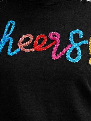 a woman wearing a black shirt with the word reese spelled in multicolored letters