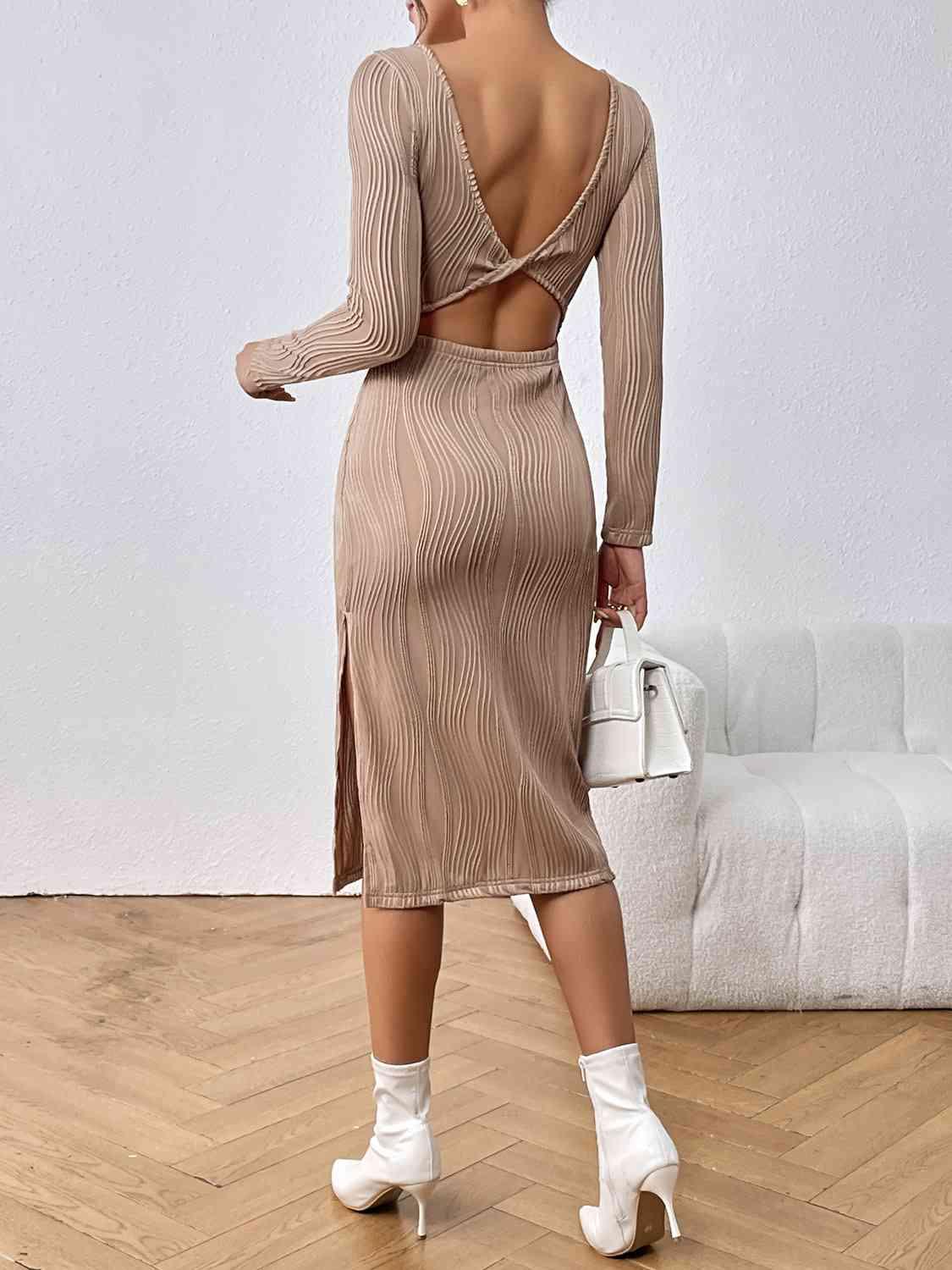 a woman in a dress with a back cut out