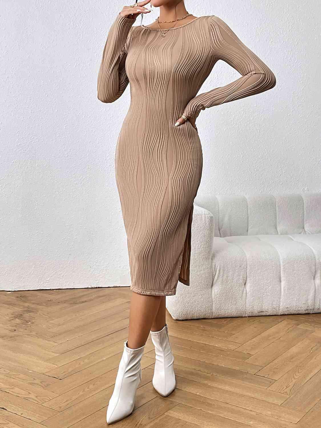 a woman in a tan dress smoking a cigarette