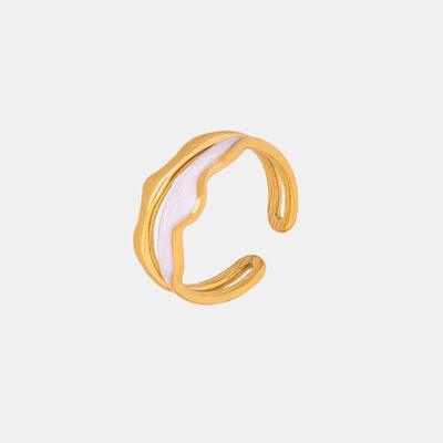 a pair of gold and white earrings on a white background