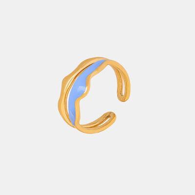 a gold and blue ring on a white background