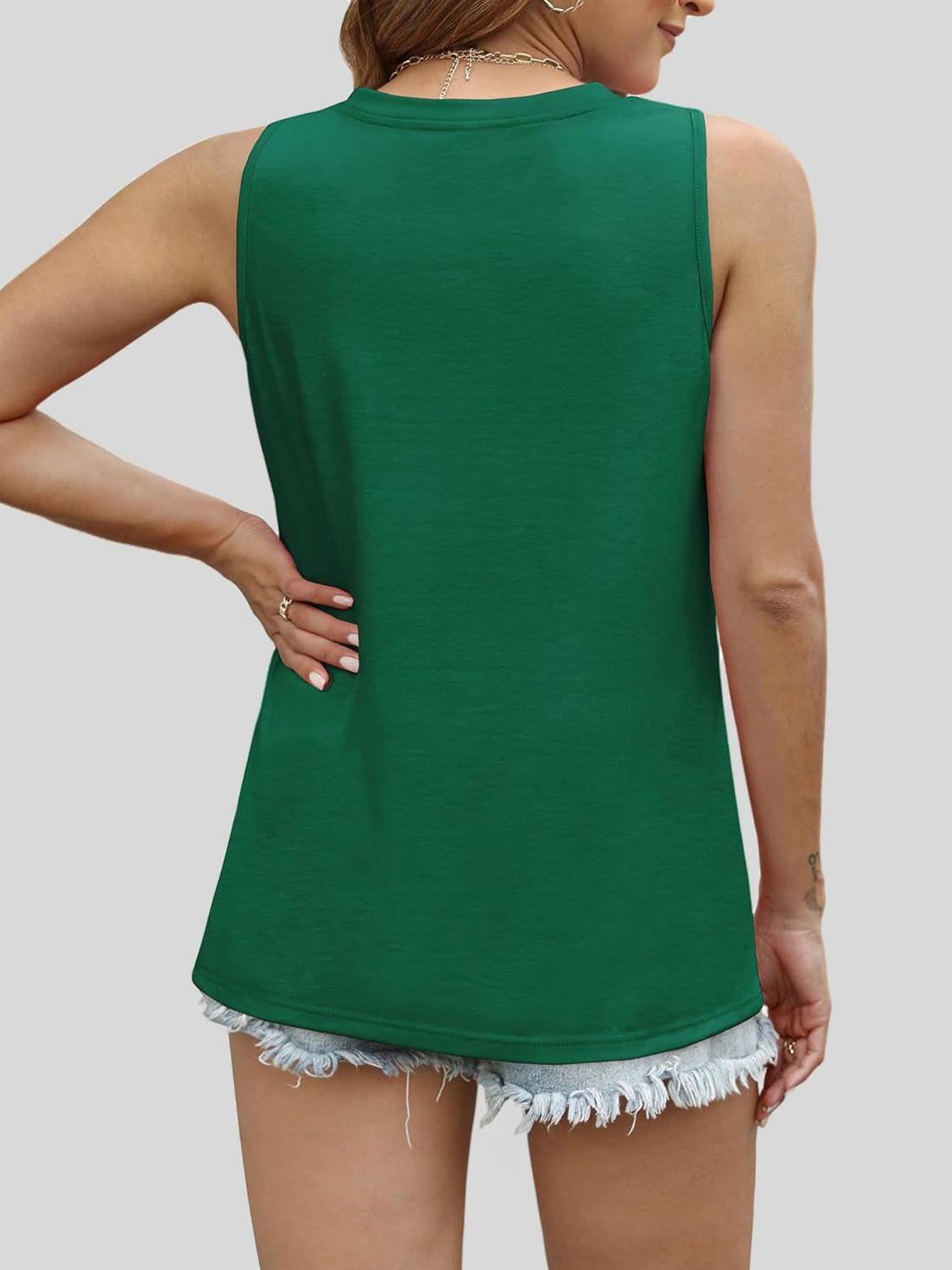 a woman wearing a green top with fray shorts