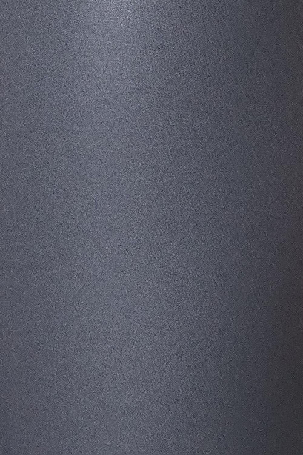a close up of a silver refrigerator with a red handle