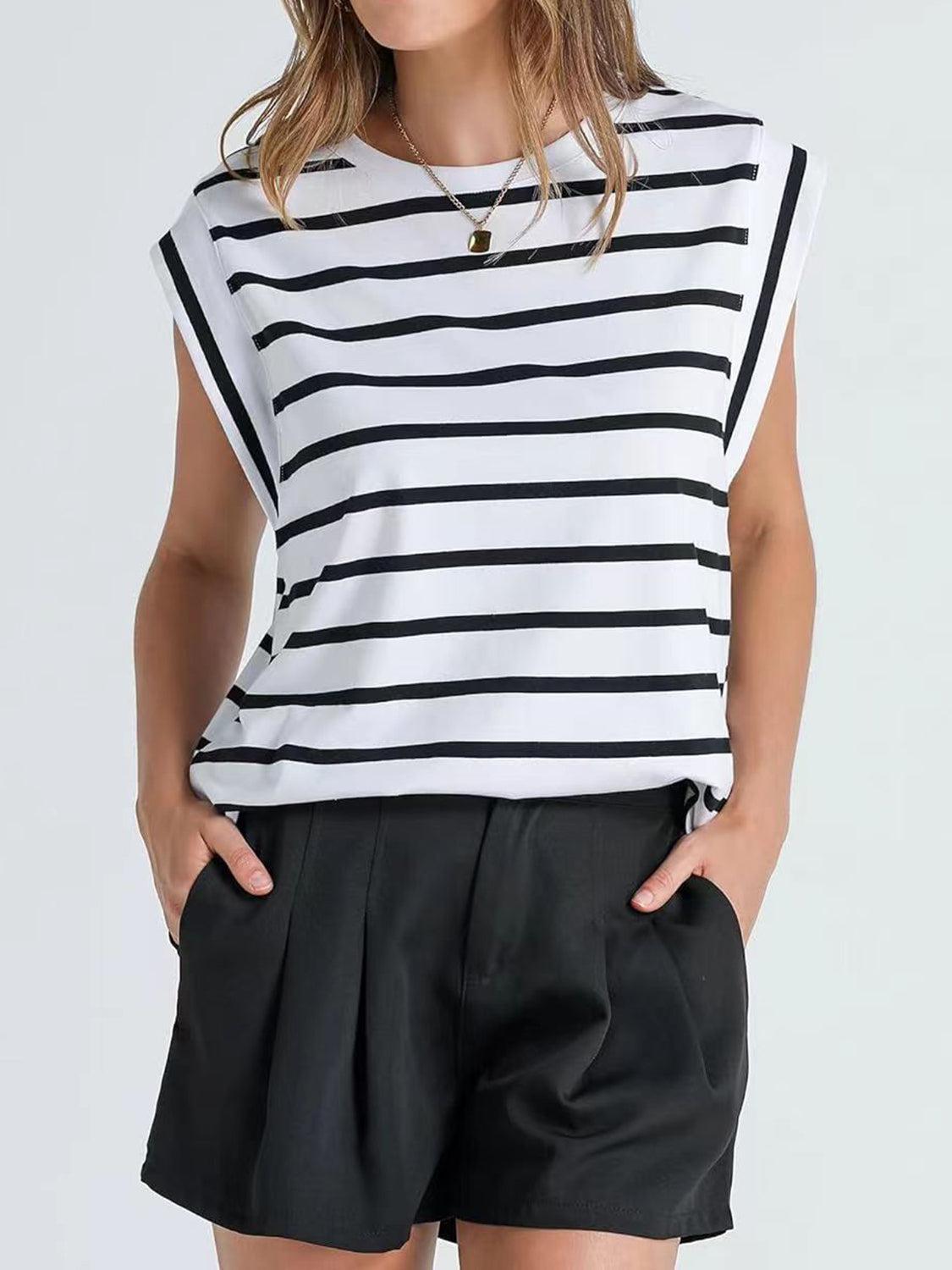 a woman wearing a black and white striped top