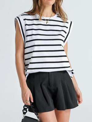 a woman wearing a black and white striped top