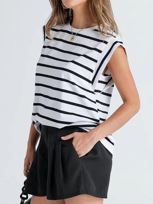a woman wearing a black and white striped top