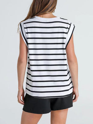 a woman wearing a black and white striped top